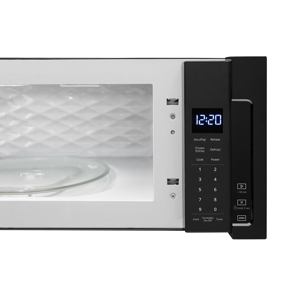Close-up of a low profile microwave control panel and interior with turntable, part of Over the Range Microwaves collection