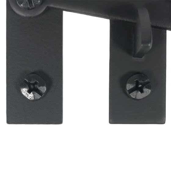Close-up of smooth black metal pig tail cabinet latch with sturdy screws for home improvement hardware under $50 collections