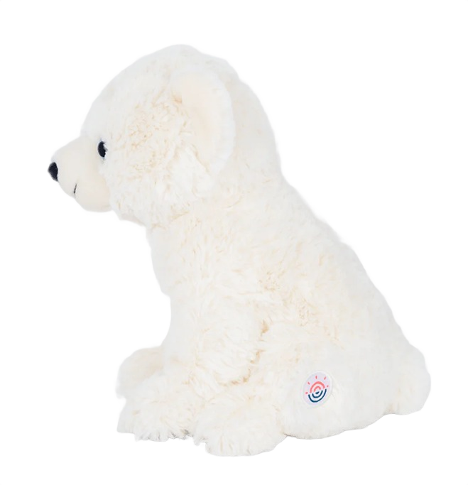 White plush polar bear toy with black nose and eyes in seated pose showing side profile
