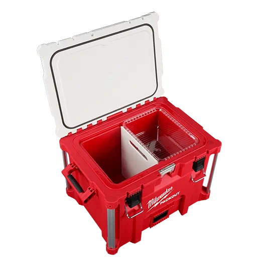 Red Milwaukee PACKOUT™ cooler with open lid showing interior storage tray and bottle opener on jobsite tool storage collection