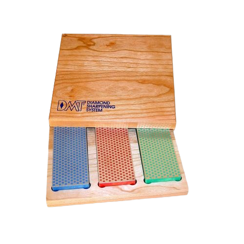 Three diamond whetstones with blue, red, and green surfaces in a wooden box for woodworking tools collections