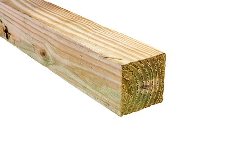 Close-up of pressure-treated 4x4 lumber with visible wood grain used for outdoor projects and home improvement tasks