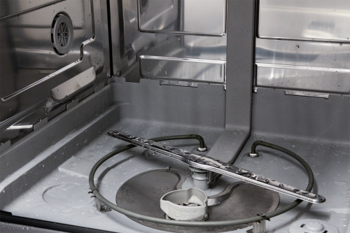 Interior view of stainless steel dishwasher showing lower spray arm and water circulation components from dishwashers collection
