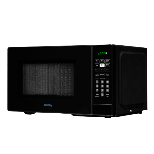 Black Danby countertop microwave with digital keypad and green LED clock in kitchen appliance collection