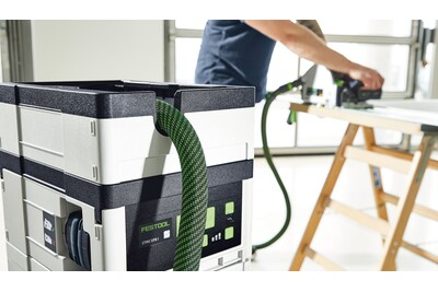 Festool cordless mobile dust extractor with HEPA-Plus filter and green hose for woodworking tools and dust collection