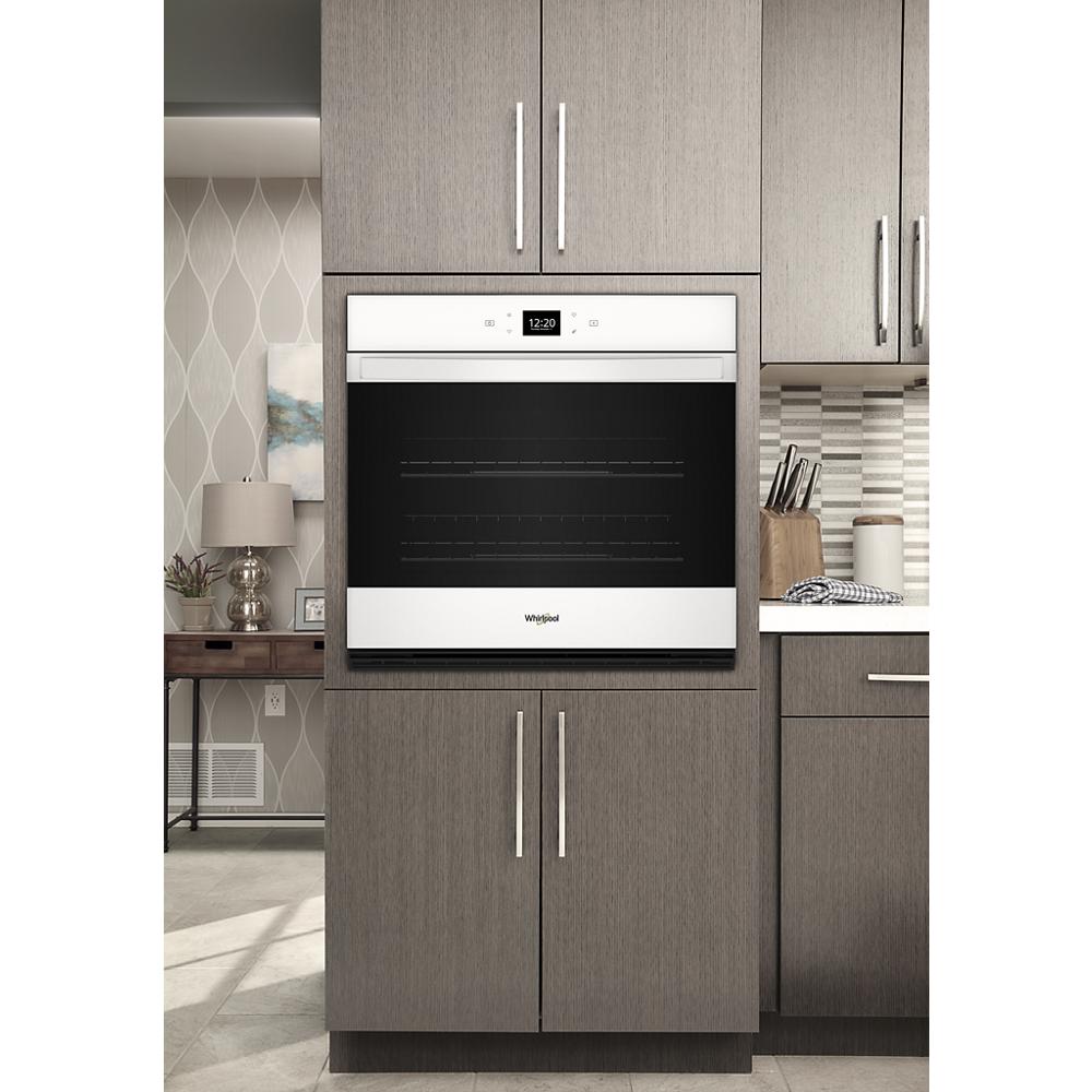 Built-in 30-inch single wall oven with stainless steel accents in modern kitchen setting for home improvement and appliances