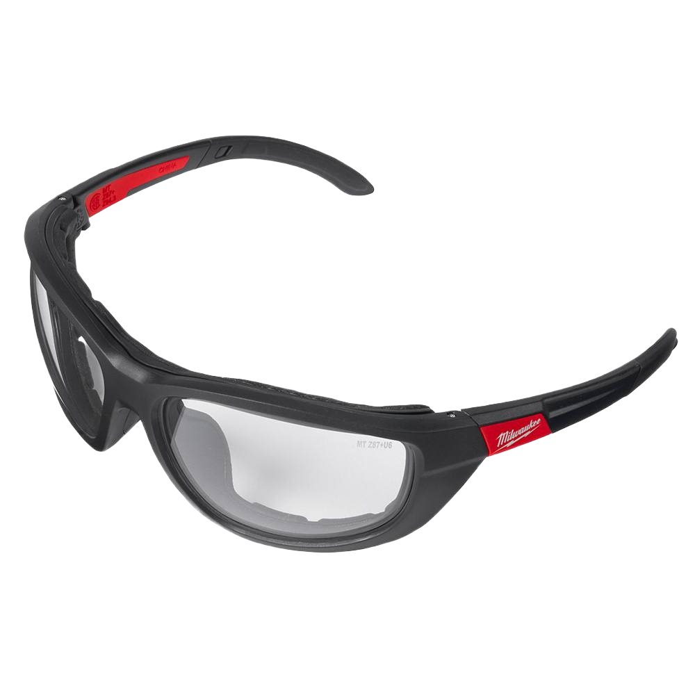 Black frame safety glasses with clear lenses and red branding, featuring a gasket for enhanced protection in home improvement tasks