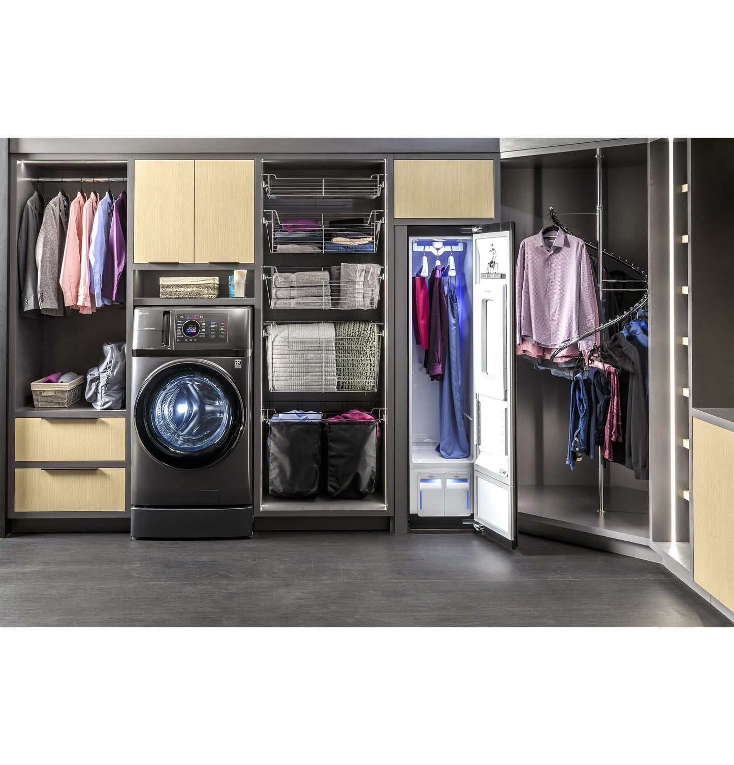 Contemporary laundry center with front load washer and open steam closet organizing clothes and fabric in dark cabinetry
