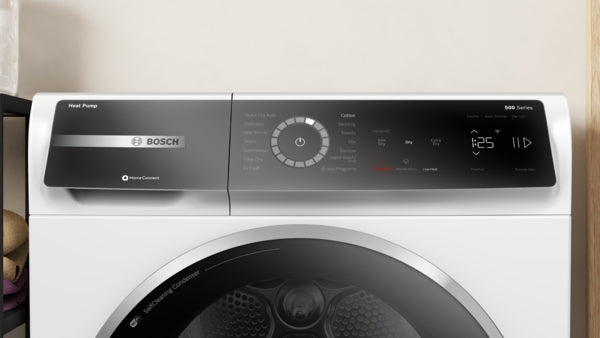 Close-up of digital control panel on white 500 Series heat pump dryer from Bosch appliances and dryers collection