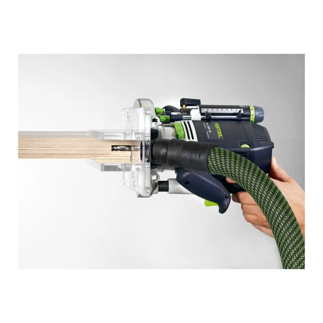 Hand-held Festool router with attached plexiglass routing template guiding a precise groove on wood in woodworking tools collection