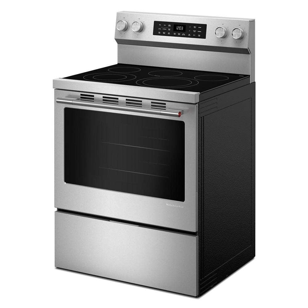 Angled view of a stainless steel freestanding electric range featuring a smooth cooktop with four burners, digital display, and large oven window for kitchenware and appliance collections.