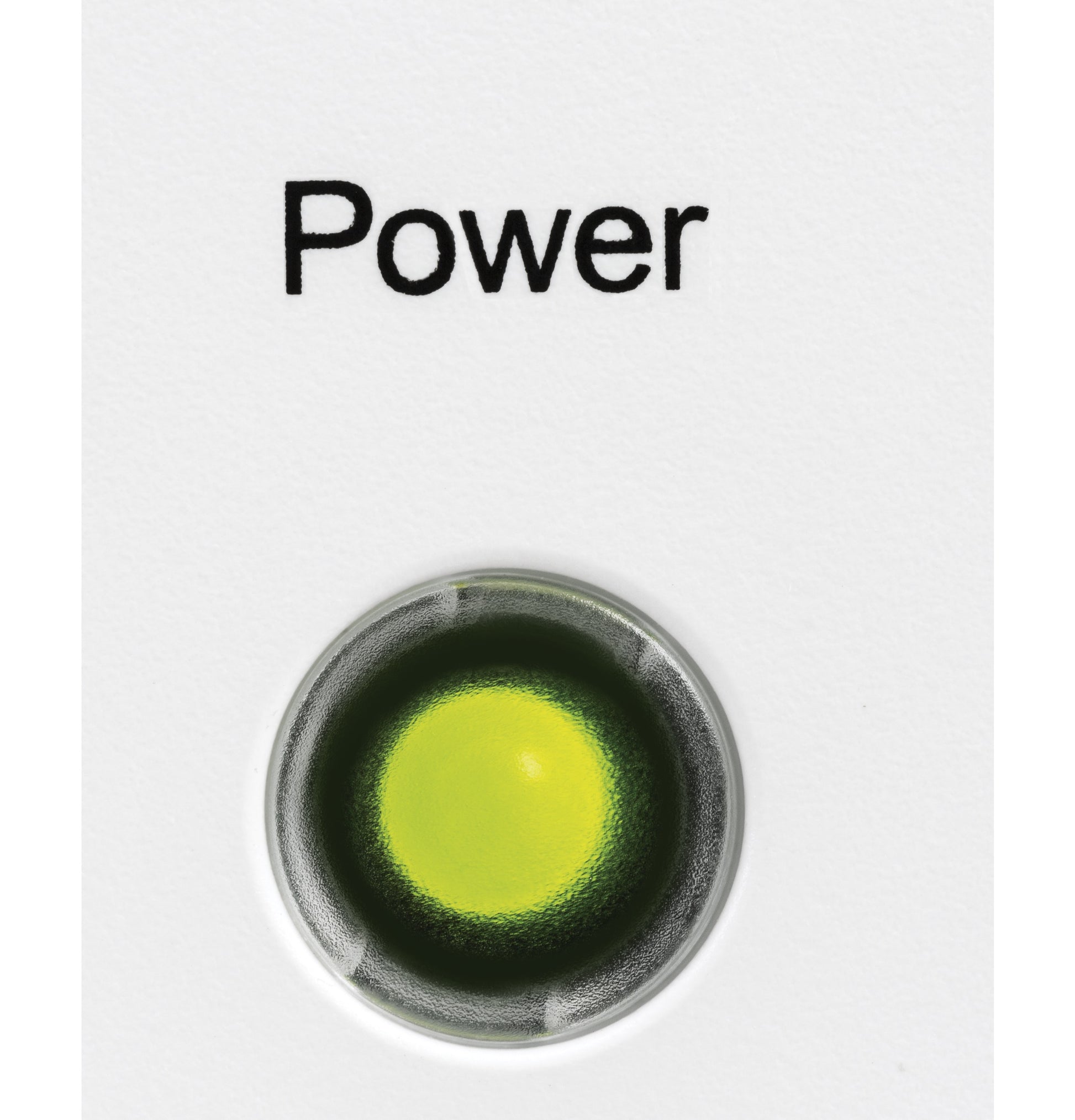 Close-up of illuminated green power light on white surface of kitchen appliance in freezers and home improvement category