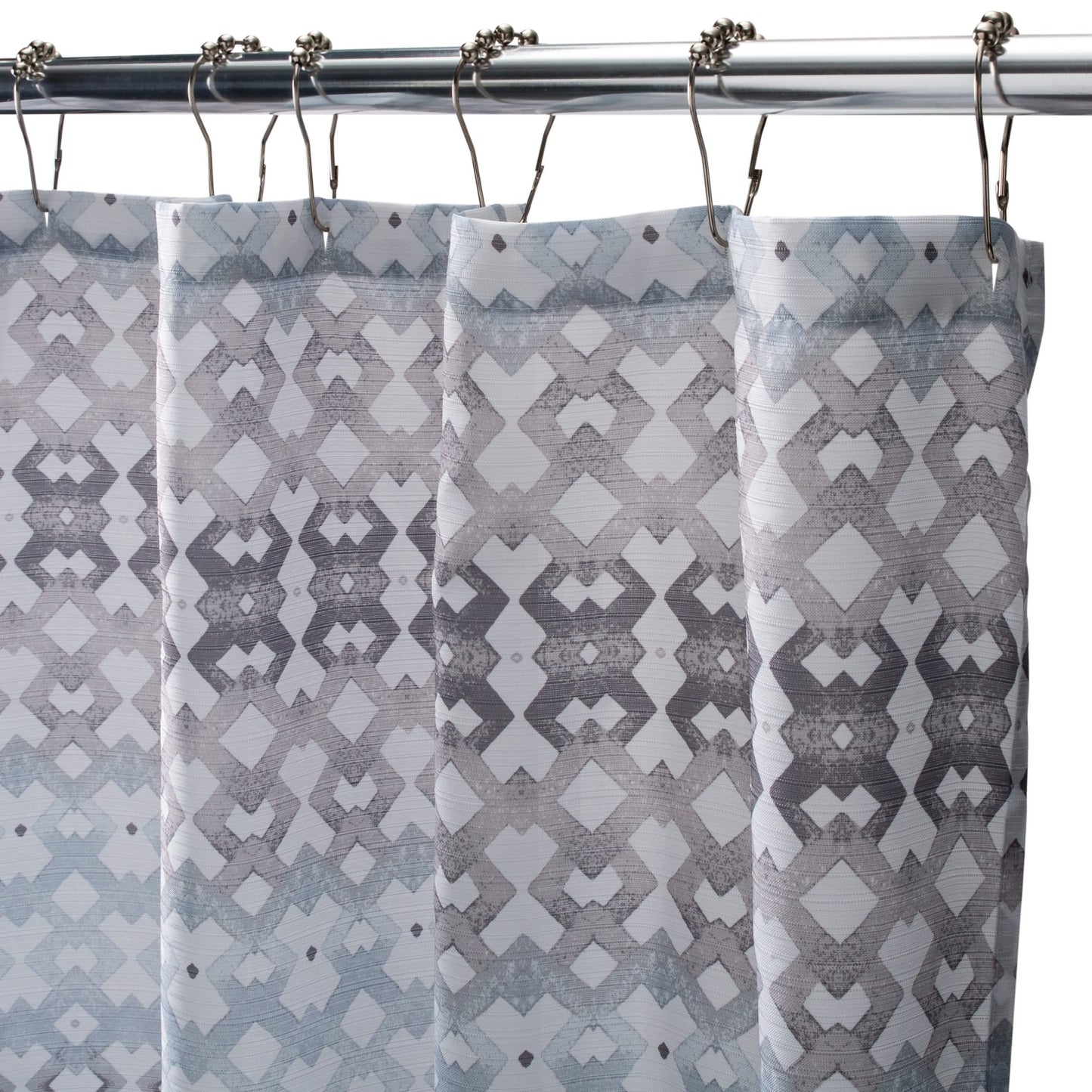 Grey and blue textured patterned fabric shower curtain hanging from silver rod with metal hooks for home improvement
