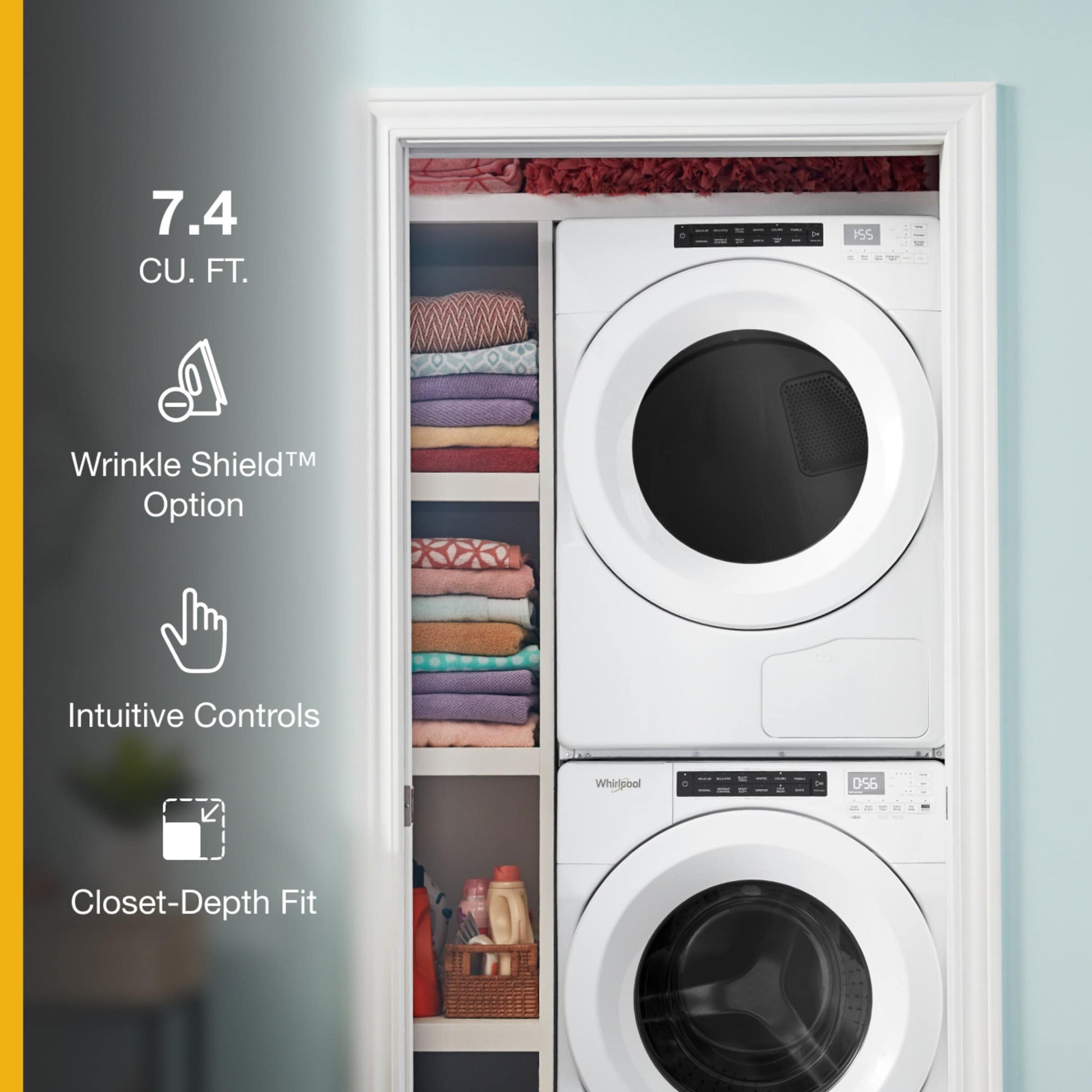 White front load electric dryer and washer stacked inside a closet with folded towels and laundry supplies nearby