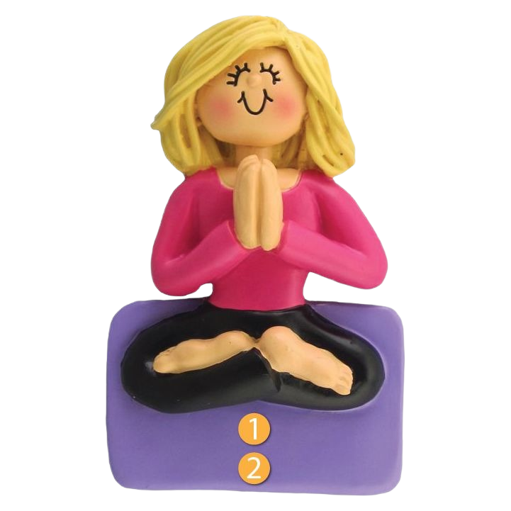 Blonde female figurine in pink top sitting cross-legged on purple mat with hands in prayer pose ornament under $50