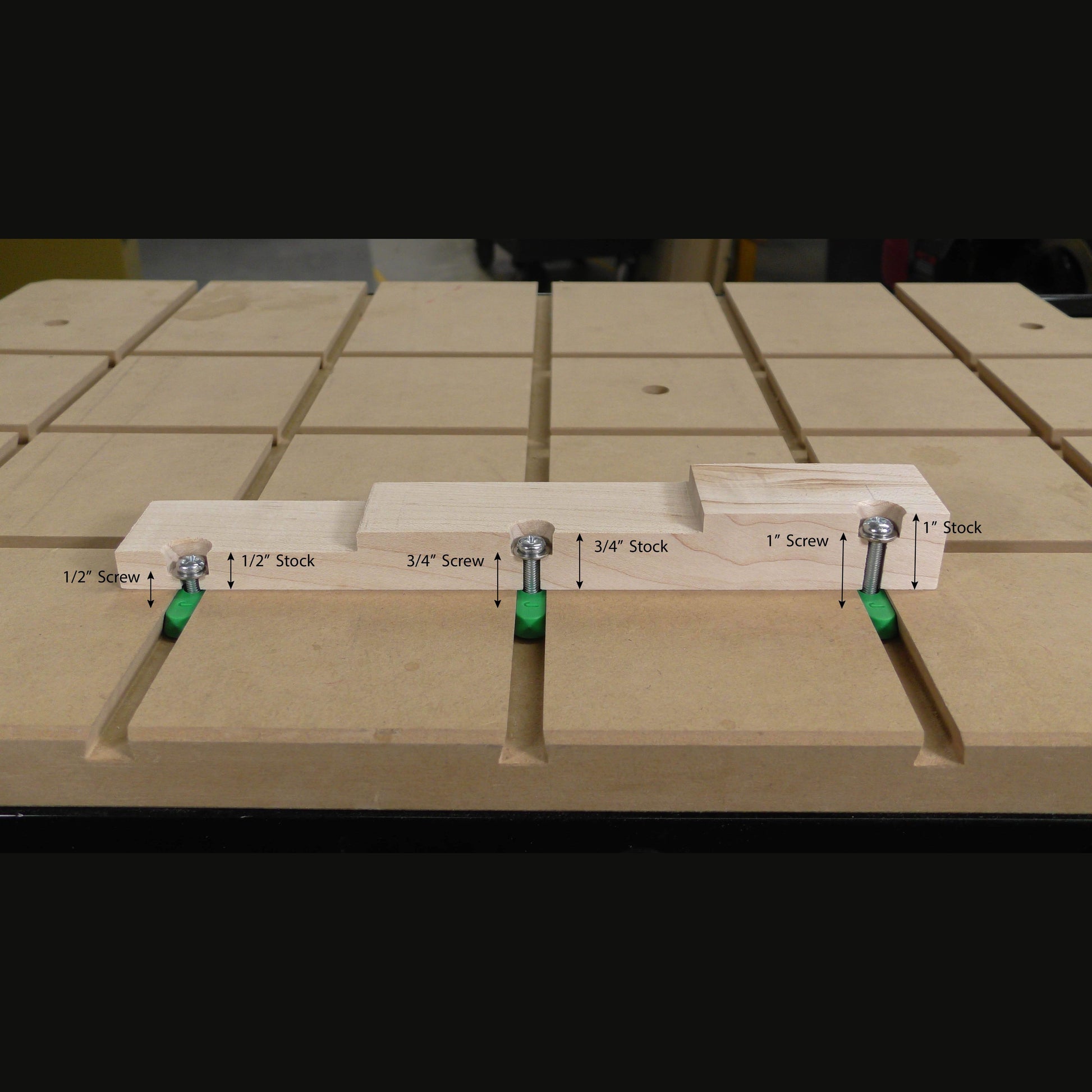 Woodworking jig with labeled screws and stock thicknesses set on a slotted workbench for tool accessories and home improvement