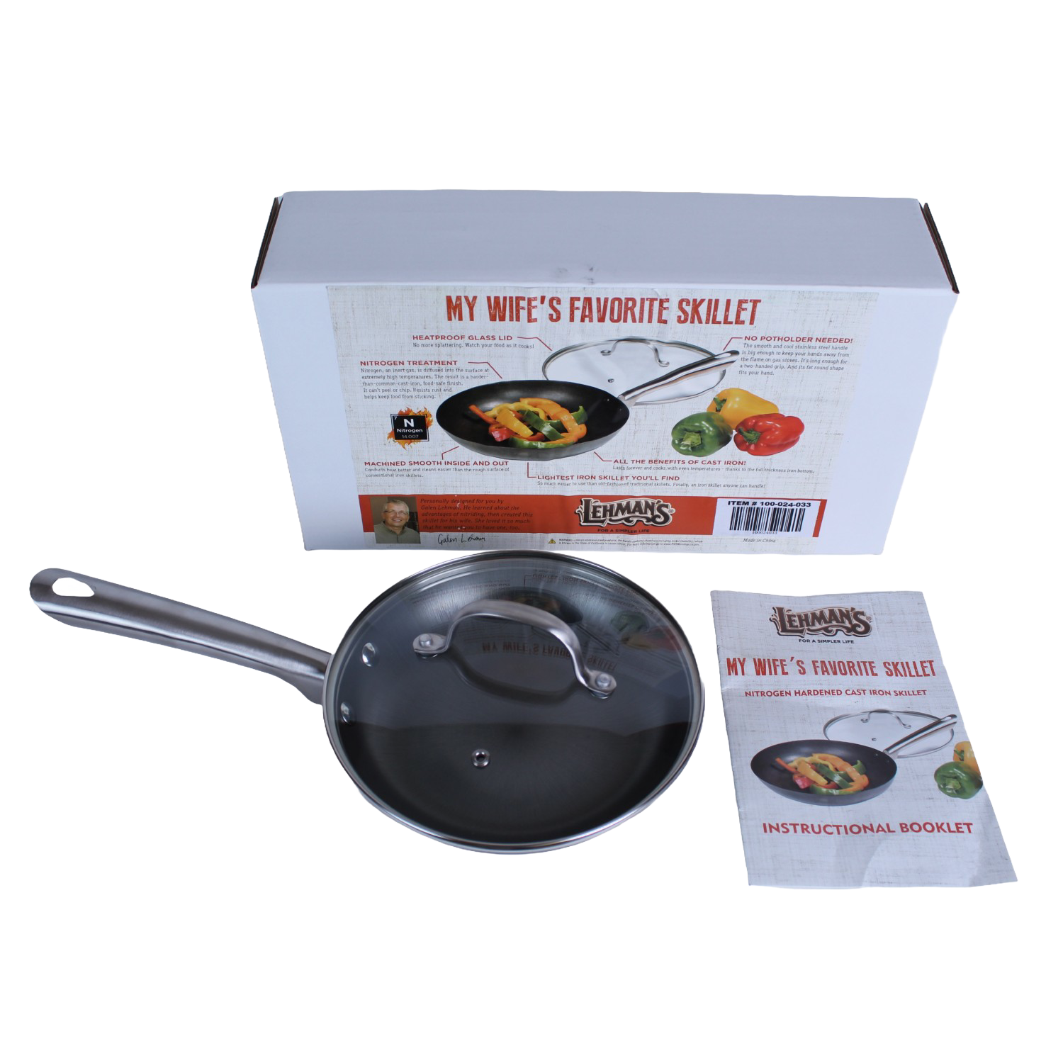 Nitrogen hardened cast iron skillet with glass lid and stainless steel handle beside packaging and instructional booklet in kitchenware collections