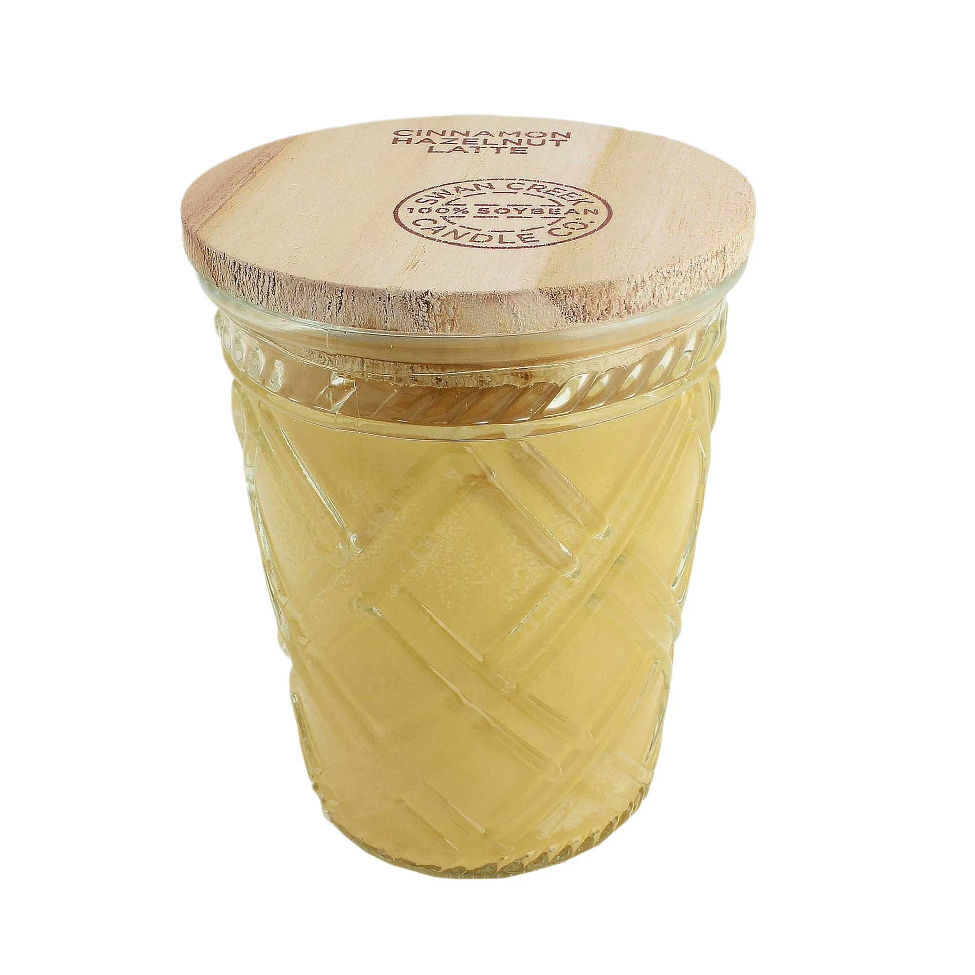 Decorative glass jar candle with wooden lid featuring cinnamon hazelnut scent in warm yellow wax