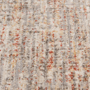 Soft textured area rug in neutral tones with subtle rust accents for home decor and flooring spaces