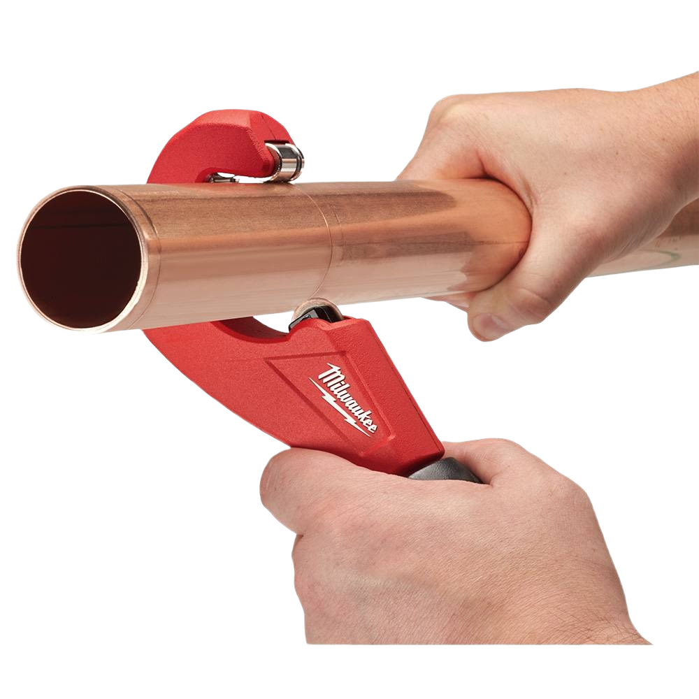 Red constant swing tubing cutter making precise cuts on copper pipe, ideal for plumbing and home improvement tools.