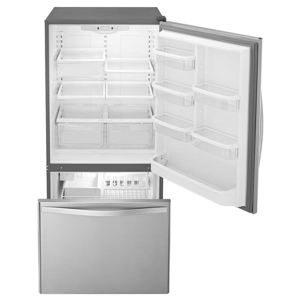 Open silver bottom-freezer refrigerator with multiple clear storage bins and door shelves in kitchen appliances collection