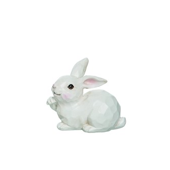 White decorative bunny sculpture with textured surface and raised ears for home decor accents