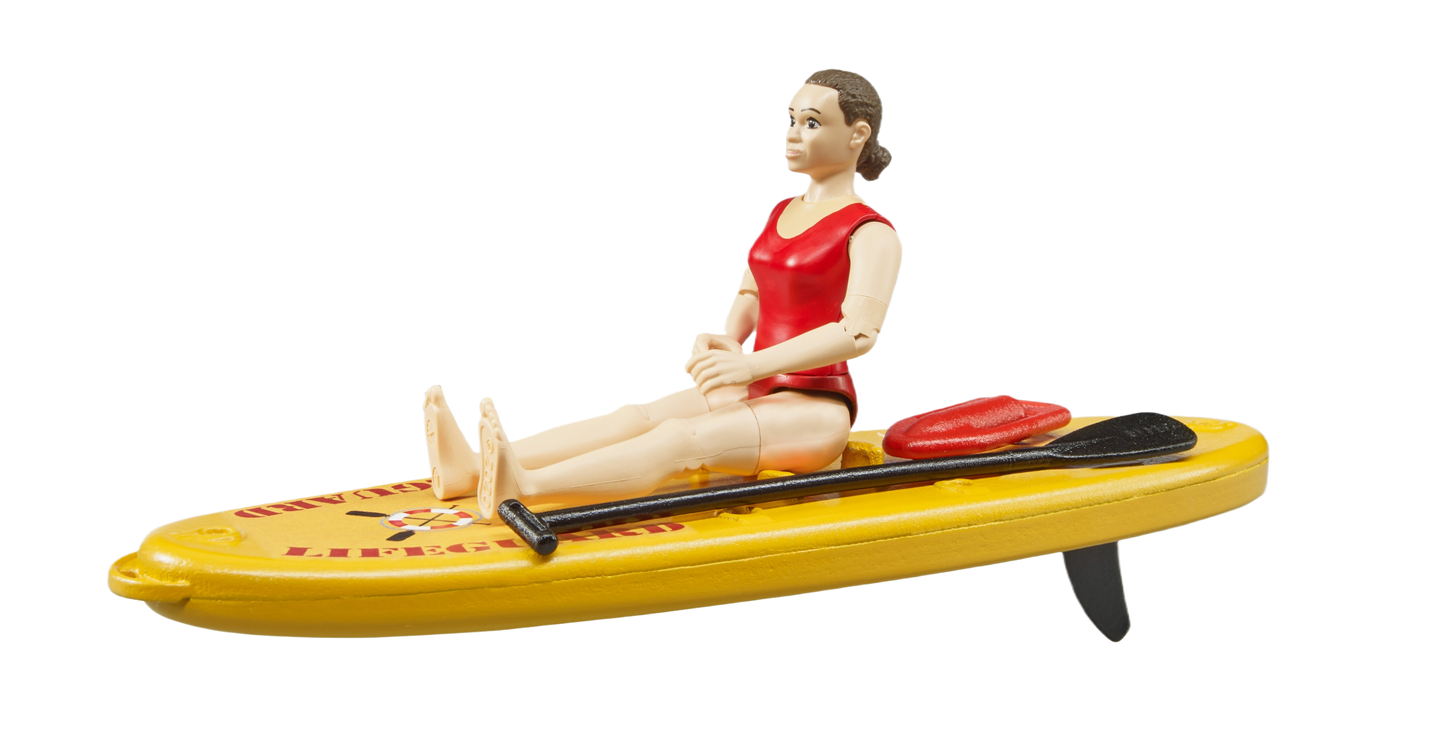 Lifeguard figure in red swimsuit seated on a yellow stand-up paddleboard with two paddles for playtime fun