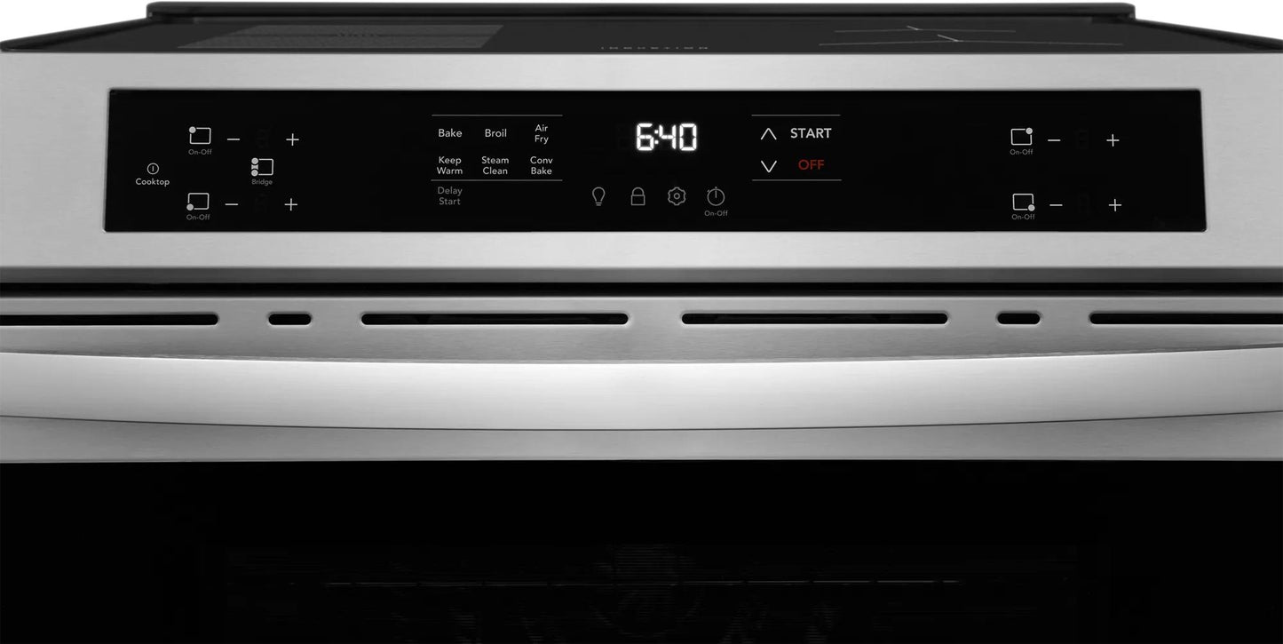 Front control panel of stainless steel induction range with digital display and touch controls for oven functions and cooktop settings