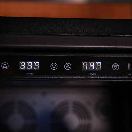 Digital temperature control panel with separate upper and lower settings on a black stainless steel beverage center