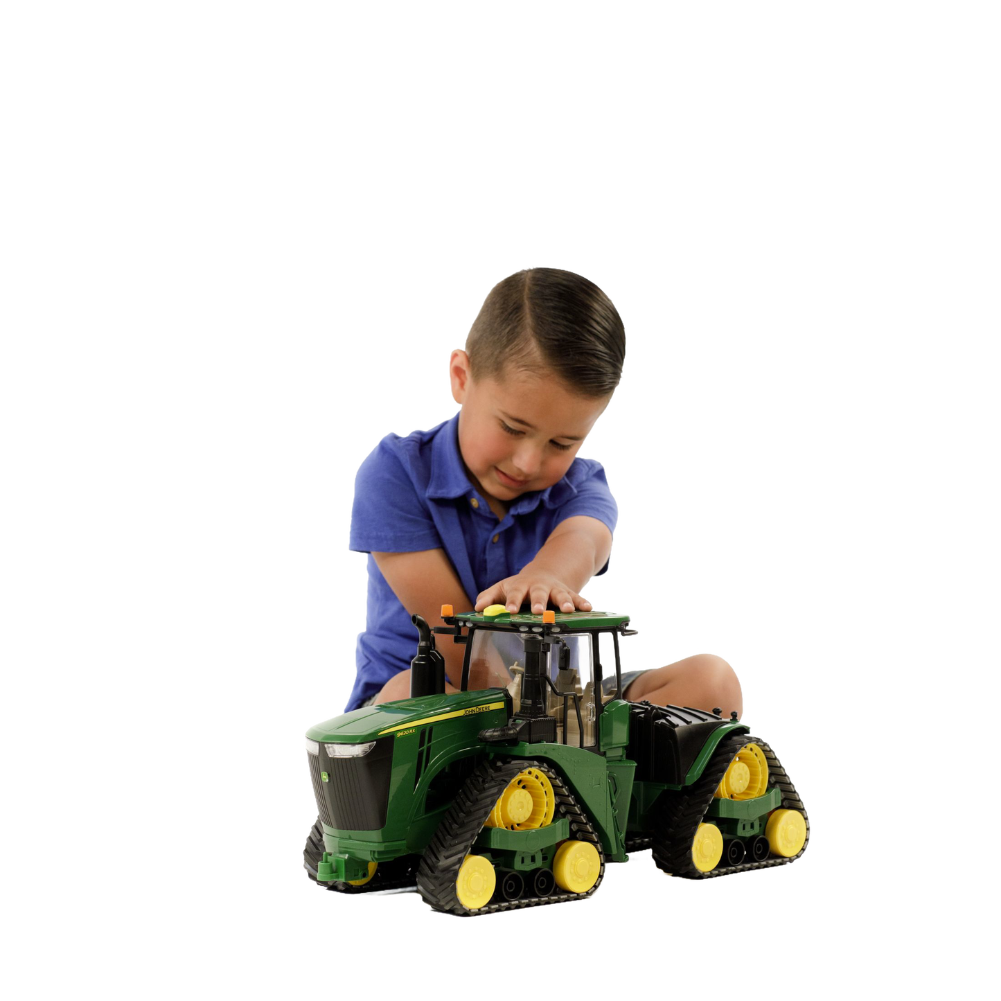 Child playing with green and yellow Bruder John Deere 9620RX toy tractor from Vehicles & Remote Controlled Toys collection