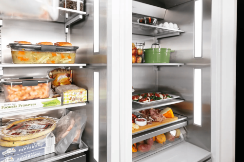 Open built-in refrigerator column with premium stainless steel interior and organized food storage from Thermador Appliances collection