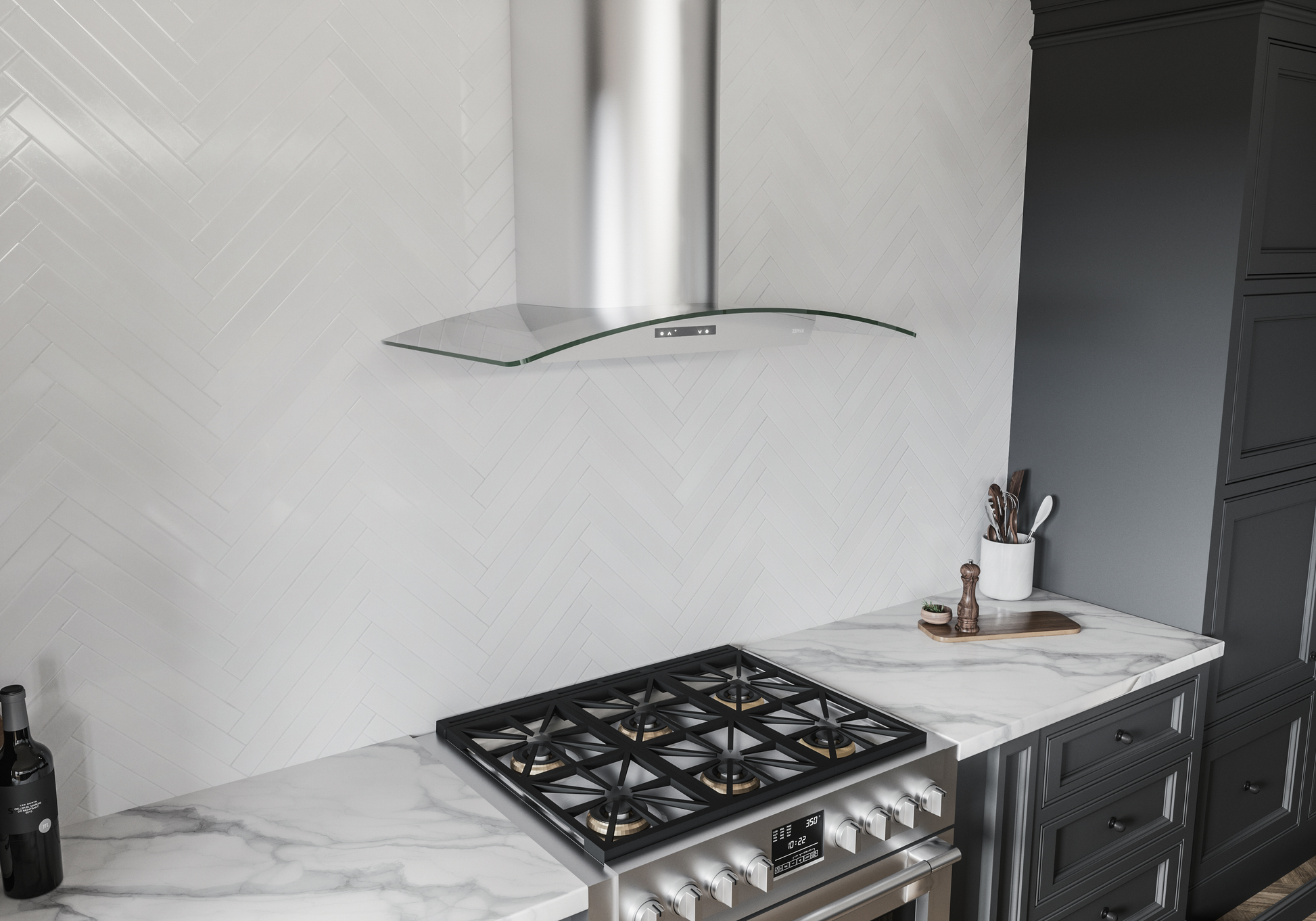 Modern stainless steel chimney hood with curved glass canopy above gas cooktop in kitchen and appliances setting
