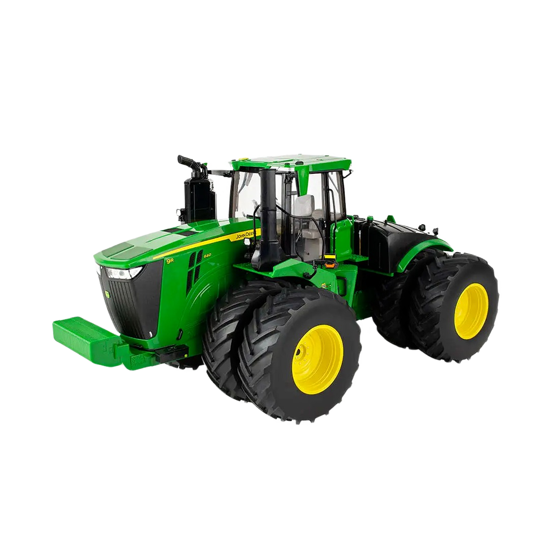 Green and yellow toy tractor with detailed cab and large tires for farm or outdoor play by Tomy
