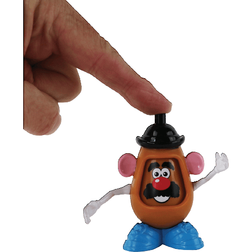 Hand touching the top hat of a miniature Mr Potato Head toy with expressive face and blue shoes