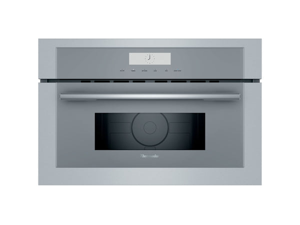 Stainless steel built-in microwave with digital display and glass touch controls in kitchen appliance collection