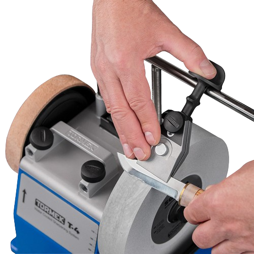 Hands adjusting Tormek KJ-45 centering knife jig on sharpening wheel for precise blade honing in tools and home improvement