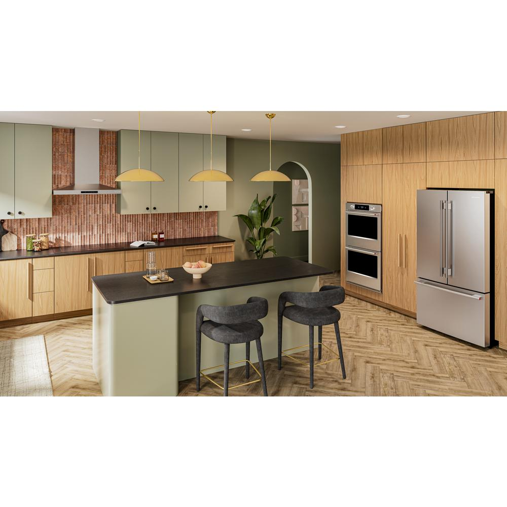 Modern kitchen with wood cabinetry, green island with dark countertop, pendant lights, and built-in double wall oven and fridge