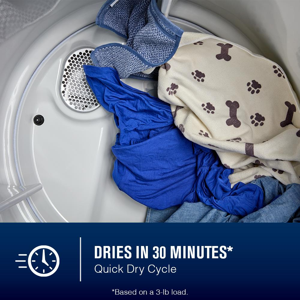 Interior view of dryer drum with mixed blue and beige pet-patterned laundry on quick dry cycle label