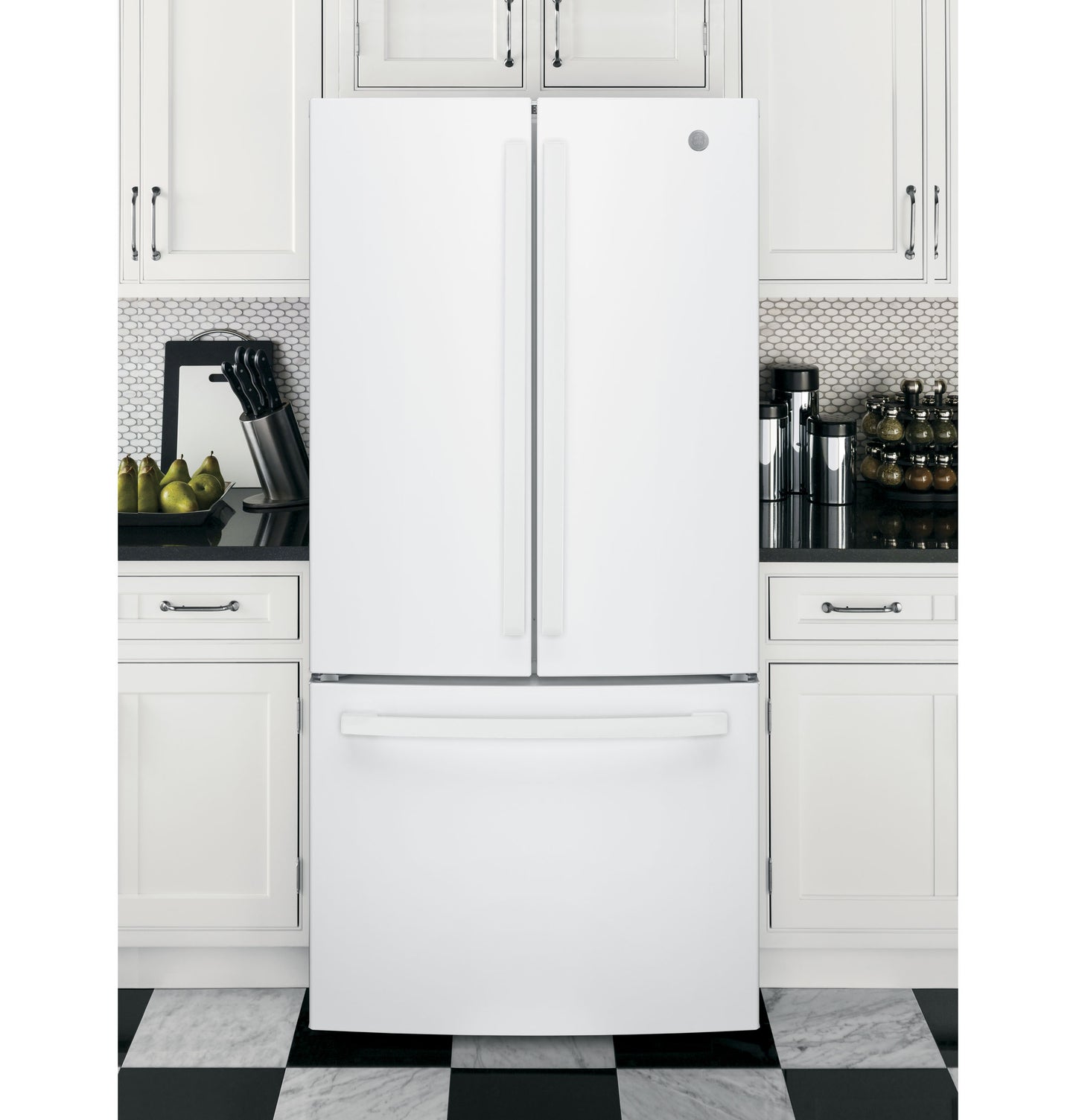 White French door refrigerator with bottom freezer integrated into modern kitchen with white cabinets and checkered floor