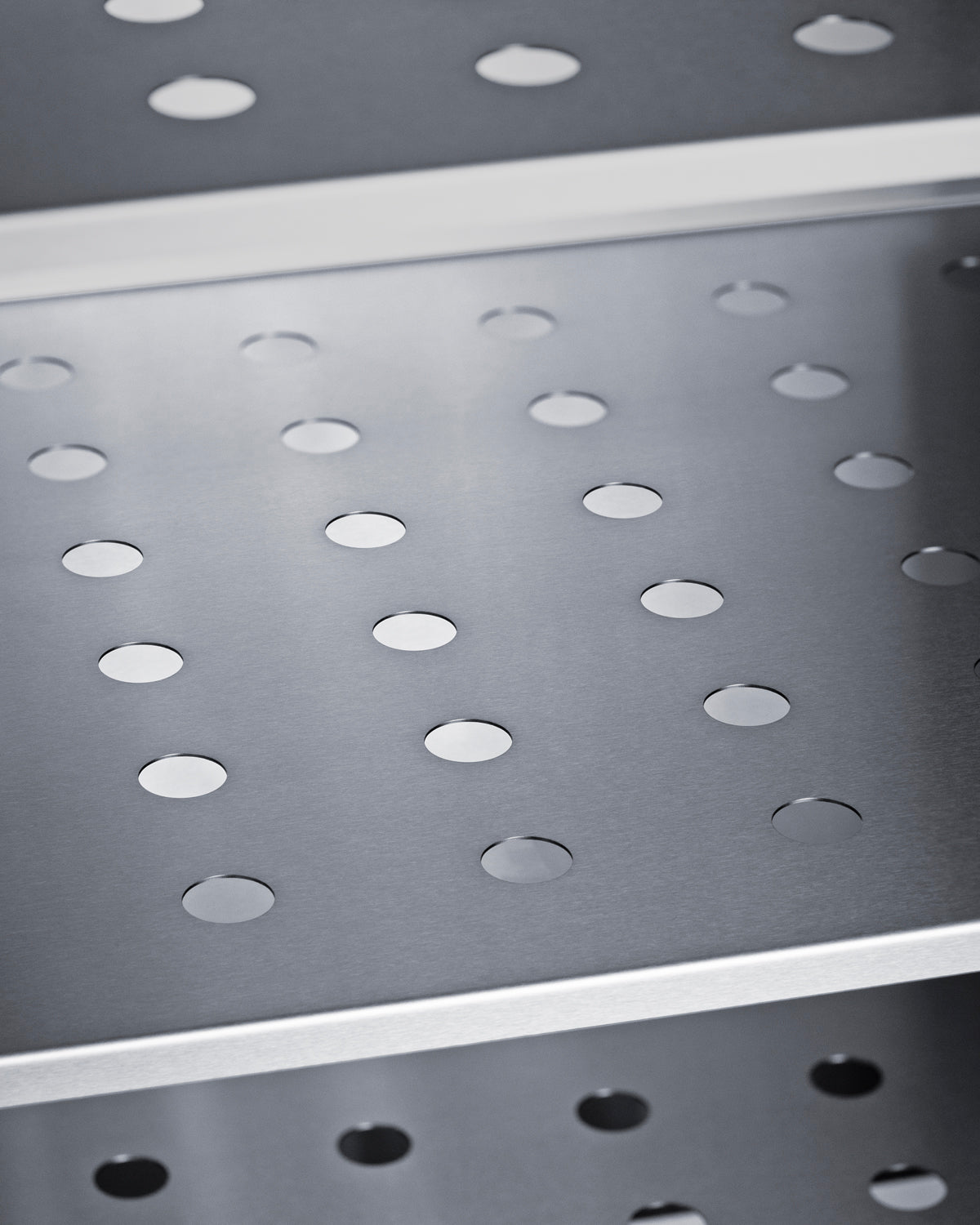 Close-up of perforated stainless steel shelf inside commercial freezer from Freezers & Ice Makers collection