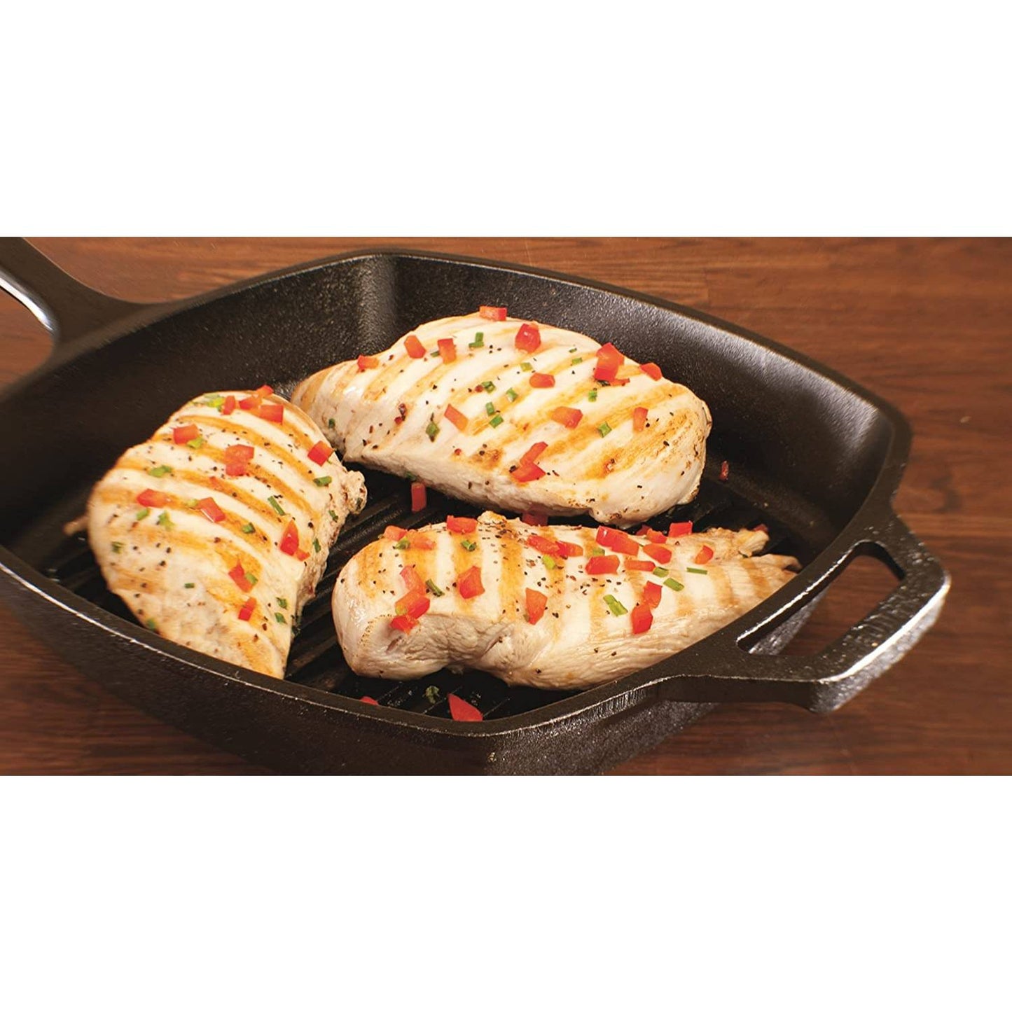 Square cast iron grill pan cooking seasoned chicken breasts with grill marks in kitchenware collections under $100