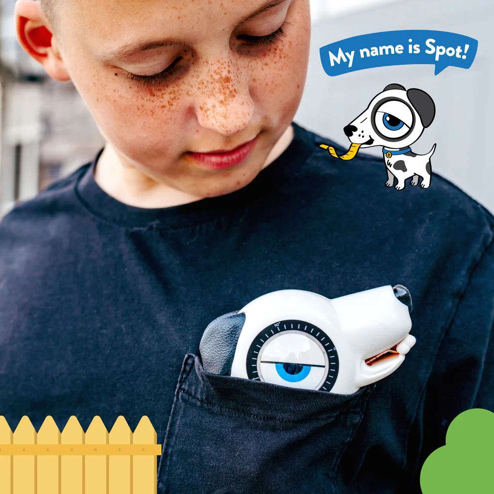Boy holding a white and black dog-shaped measuring tape partially tucked into a black shirt pocket