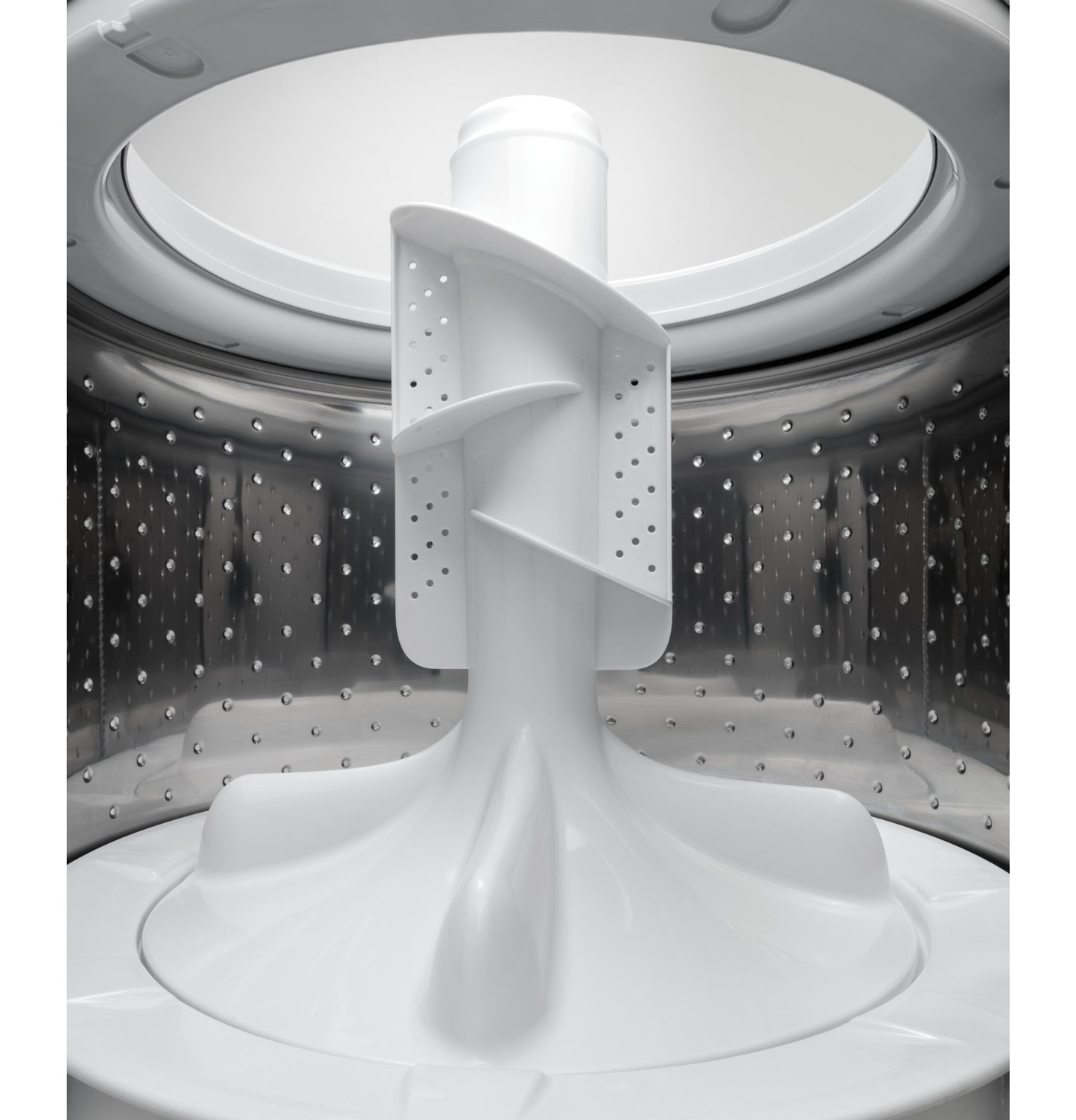 Interior shot of stainless steel washer drum with central agitator in top load washers and appliances collection