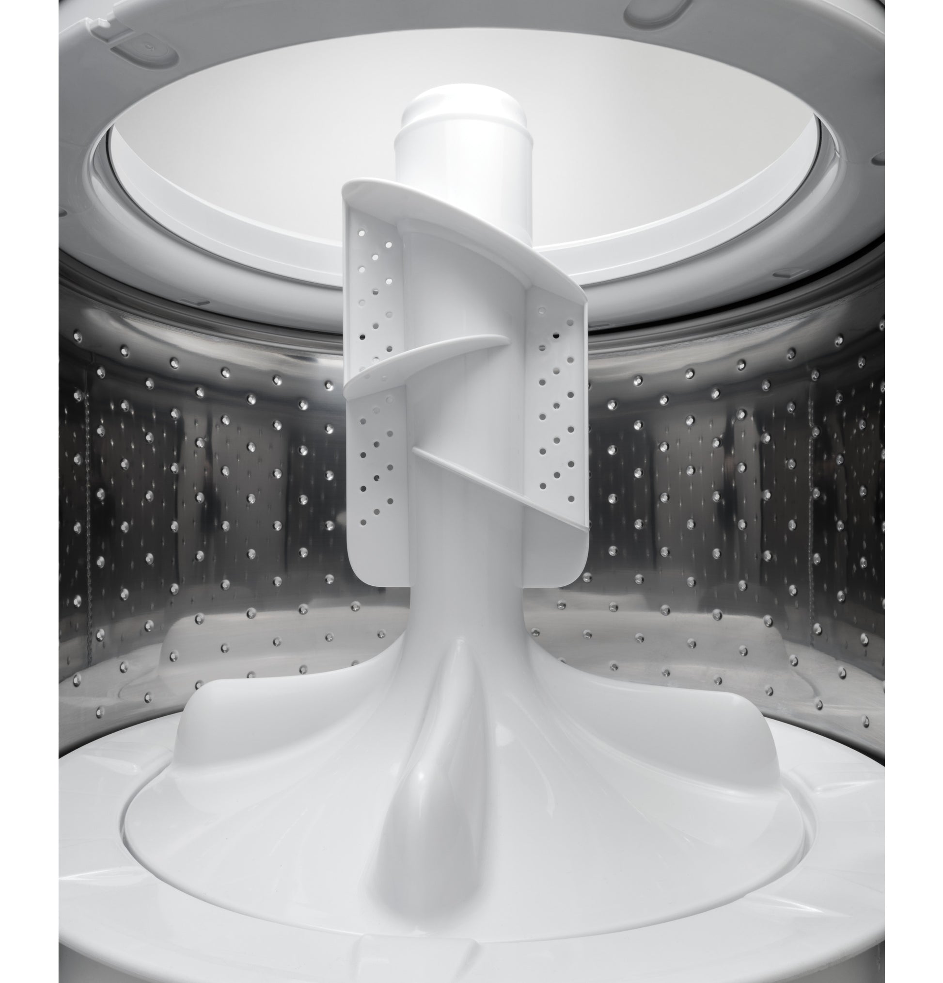 Interior shot of stainless steel washer drum with central agitator in top load washers and appliances collection