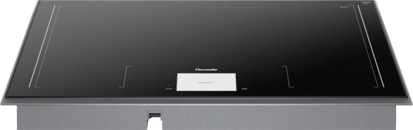 Dark gray surface mount induction cooktop with smooth glass surface and digital controls from kitchen appliances collection