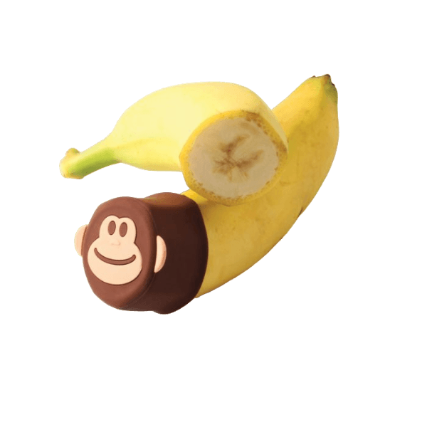Flexible brown silicone cover with monkey face design sealing the end of a cut banana for kitchen storage collections