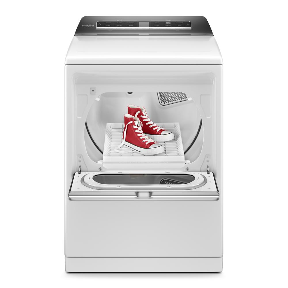 White top load electric dryer with built-in shoe rack holding red sneakers in modern laundry appliance collection