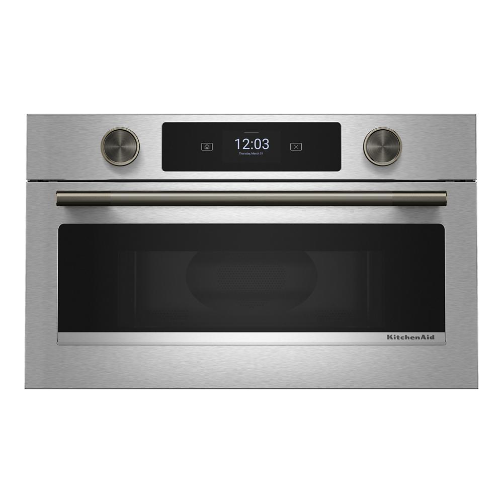 Stainless steel built-in microwave with digital display, dual knobs, and a horizontal handle from kitchen appliances collection