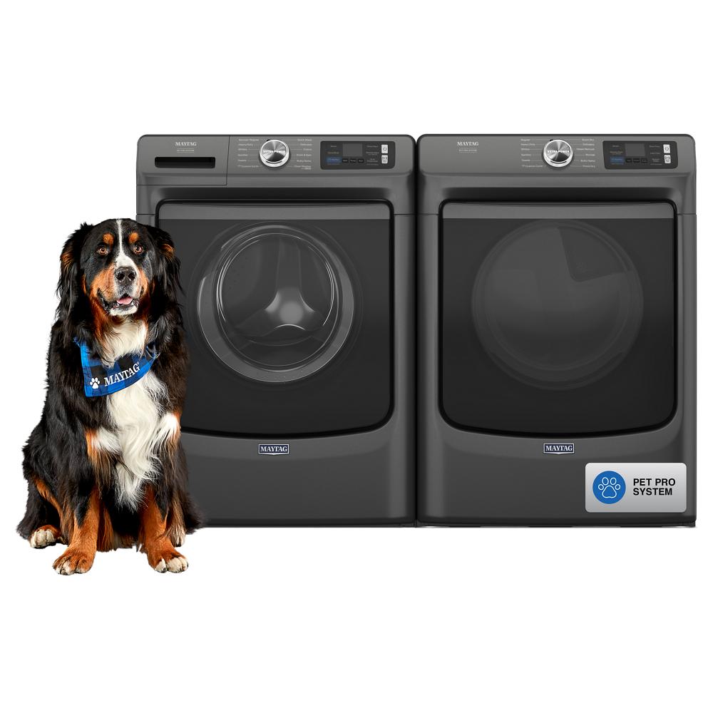 Front load washer and dryer in dark finish with digital controls and a dog wearing a branded bandana beside them