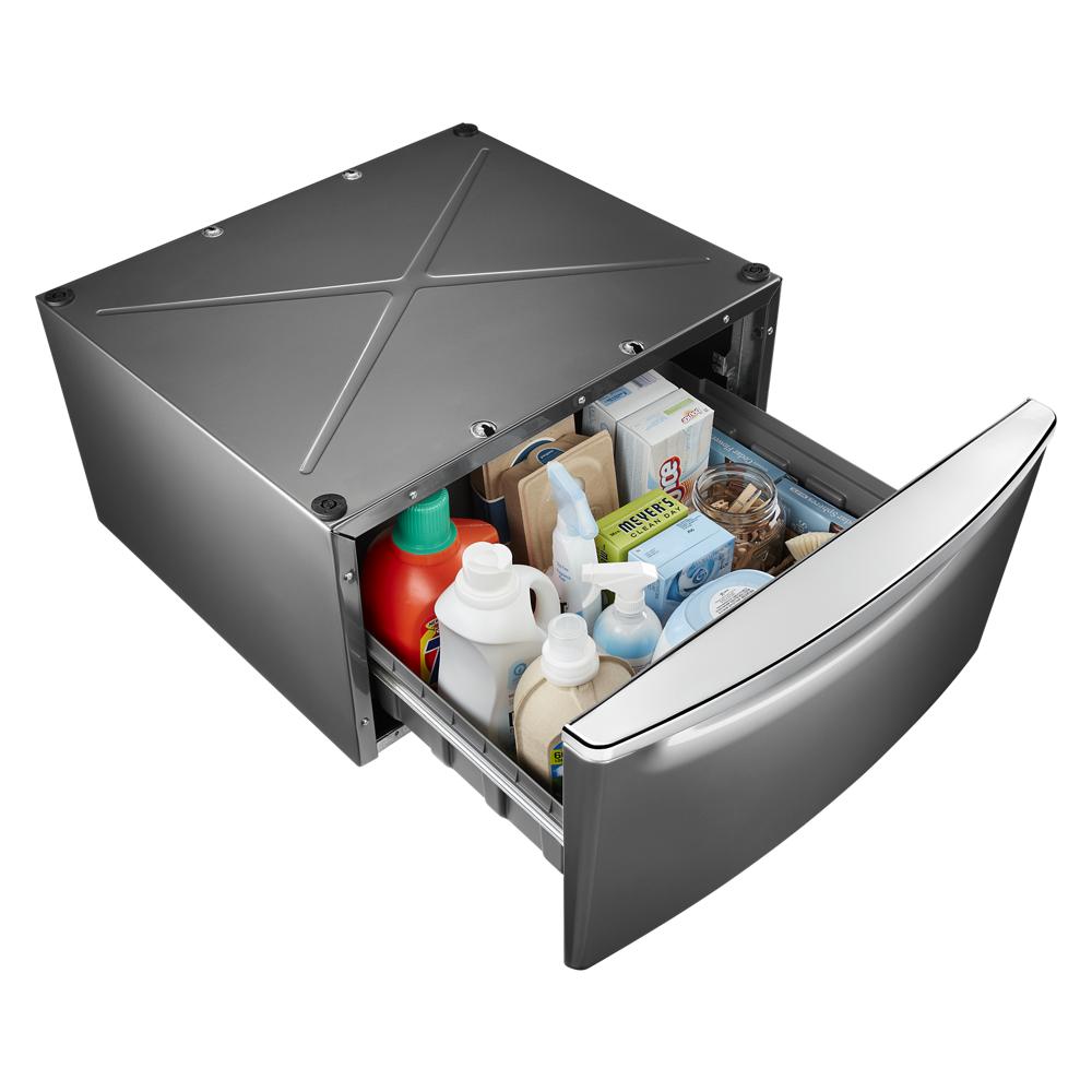 Metal pedestal drawer for laundry storage filled with detergent and cleaning supplies in appliance parts collection